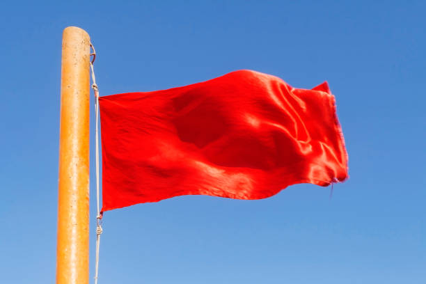 istock red flag to develop on the background of blue sky 652423140