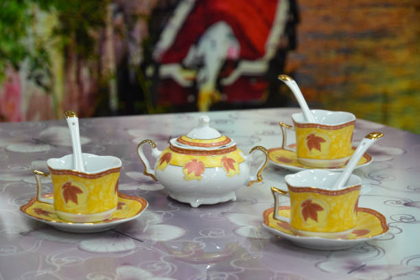 istock Sugar bowl and three teacups on the table 652423812