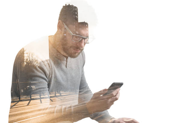 istock Double exposure of man using phone with city street 652426328