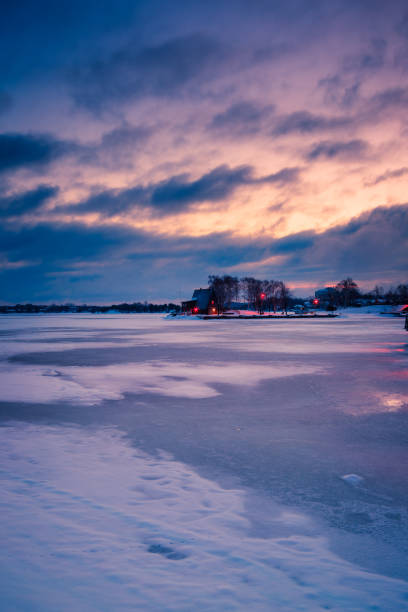 istock frozen lake during sunrise in winter season 652428482