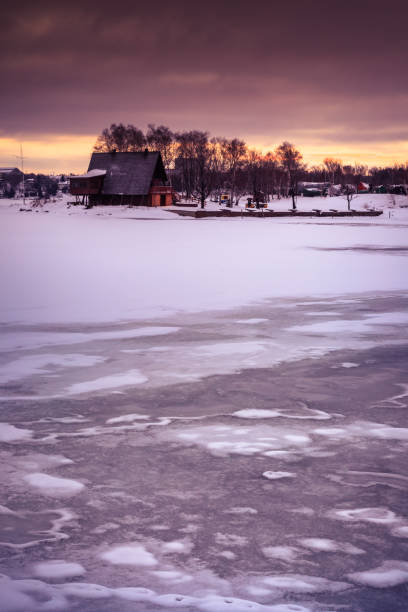 istock frozen lake during sunrise in winter season 652428504