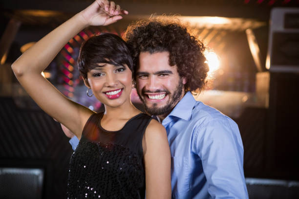 istock Cute couple dancing together on dance floor 652437394
