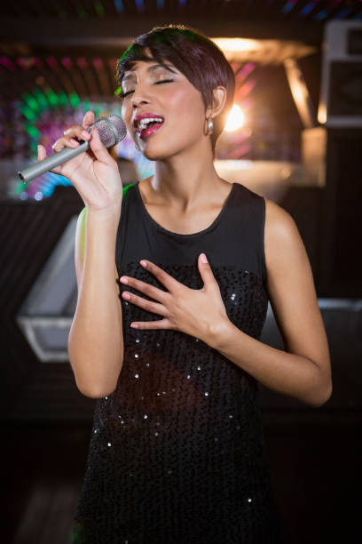 istock Woman singing in bar 652437464