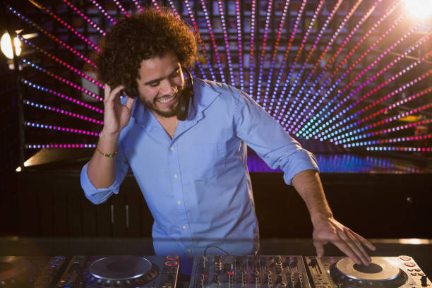istock Male DJ playing music 652437526