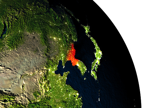 North Korea highlighted in red on model of planet Earth with very detailed land surface and visible city lights. 3D illustration. 3D model of planet created and rendered in Cheetah3D software, 7 Mar 2017. Some layers of planet surface use textures furnished by NASA, Blue Marble collection: http://visibleearth.nasa.gov/view_cat.php?categoryID=1484