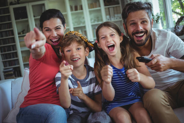 istock Excited family watching television 652486406