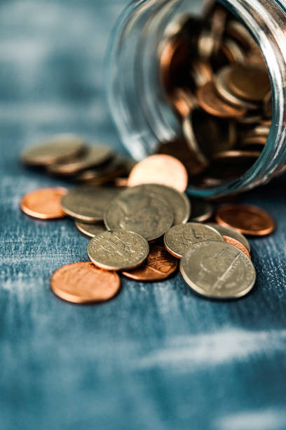 istock Glass jar filled with American currency 652493430
