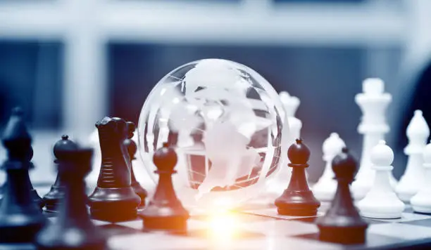 Photo of Globe and chess pieces