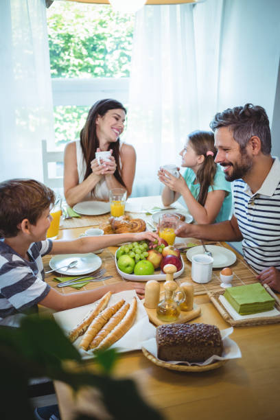 istock Happy family having breakfast together 652500156