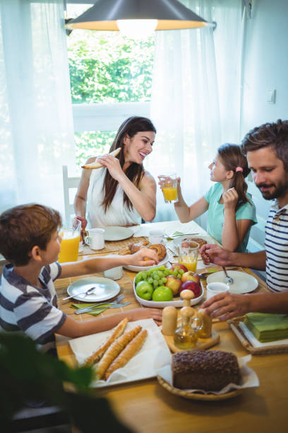 istock Happy family having breakfast together 652500174