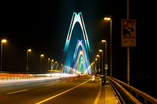 Ha Noi capital, Viet Nam - October 23, 2016: Nhat Tan bridge over Hong Red river from Noi Bai International Airport to the center of Hanoi capital in the night light