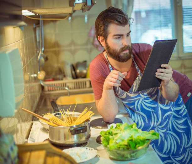 istock Handsome bearded young man making healthy meal 652500502