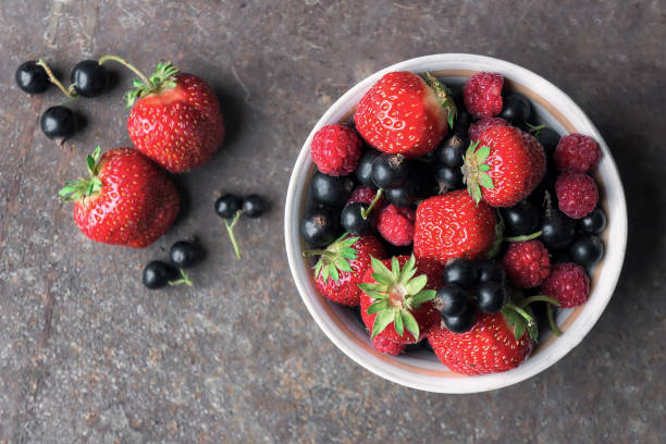 istock Fresh ripe berries on rustic grunge background. Top view. 652500836