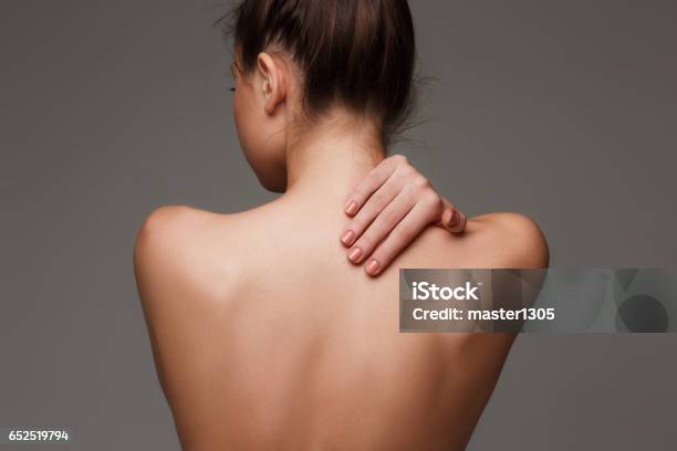 The Beautiful Womans Body On Gray Background Stock Photo - Download Image Now - Rear View, Back, Women