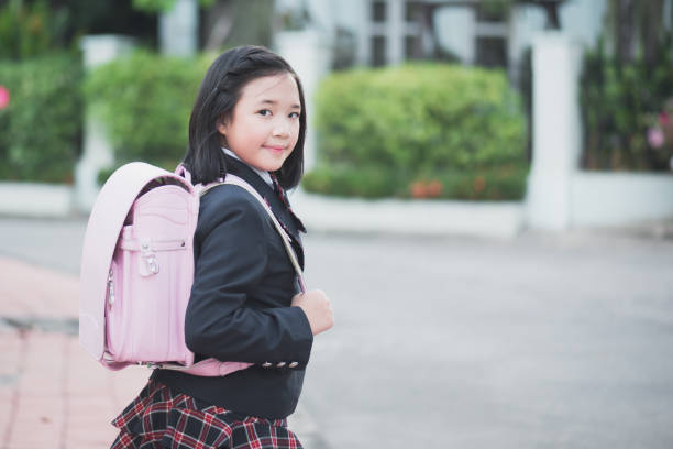 istock Asian school girl with pink backpack outdoors,back to school concept 652533010