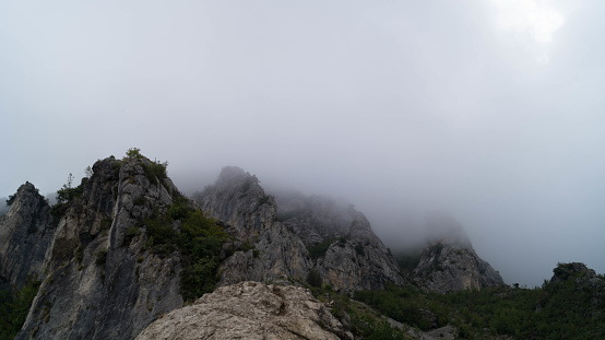 Dramatic clouds covering rocky mountains in Croatia