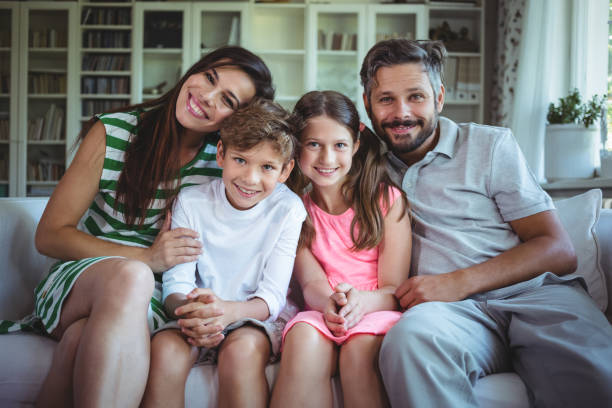 istock Happy family sitting on sofa 652549746