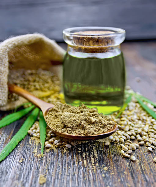 istock Flour hemp in spoon with oil and bag on dark board 652555986