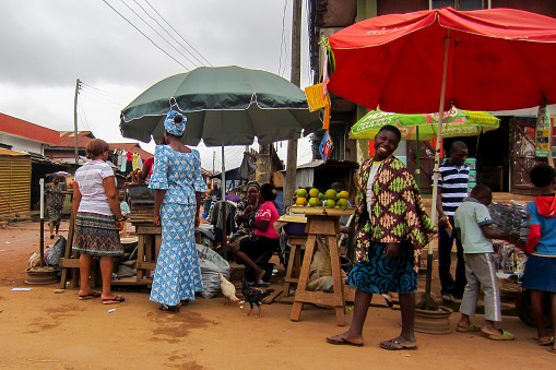LAGOS, NIGERIA - AUGUST 10, 2012: People selling different goods in the street in the city of Lagos, the largest city in Nigeria and the African continent. Lagos is one of the fastest growing cities in the world