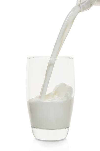istock Milk is poured into a glass 652560822
