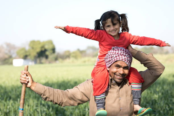 istock Father carrying daughter on shoulders 652563022