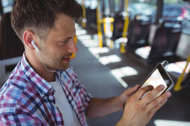 istock Handsome man listening music on digital tablet 652563976