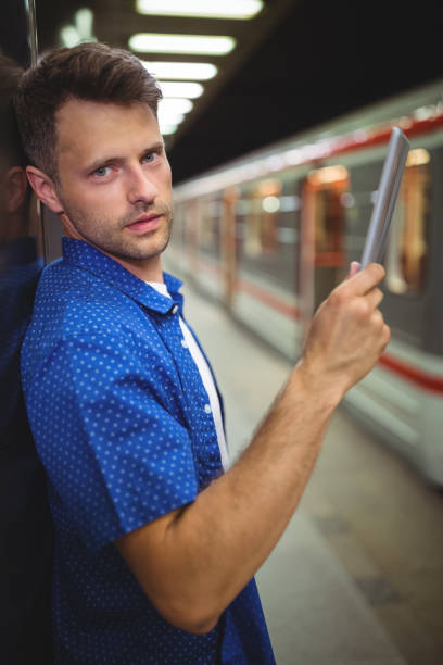 istock Portrait of handsome man using digital tablet 652564478