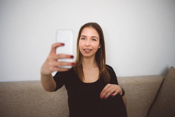 istock women taking selfie at home 652567232