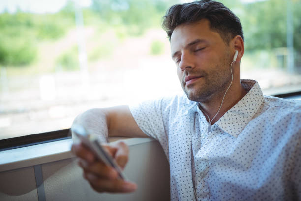 istock Handsome man listening music on mobile phone 652568702