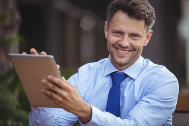 istock Portrait of businessman using digital tablet 652571114