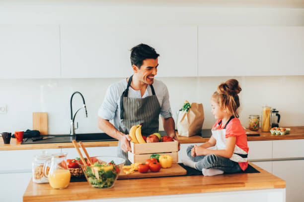 istock Father and daughter in the kitchen 652572520