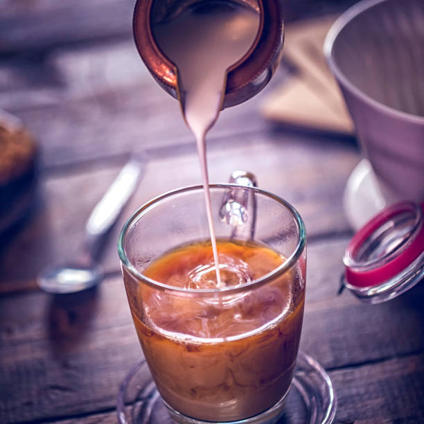 istock Pouring Milk into Cup of Coffee 652573848