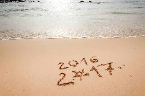 istock Happy New Year 2017 on the beach 652579412