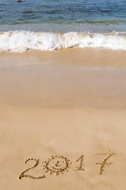 istock Happy New Year 2017 on the beach 652579468