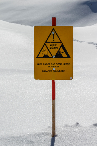 Warning sign indicating the ski area boundary of a slope at the Hintertuxer Glacier (Tuxer Ferner) in Tyrol, Austria