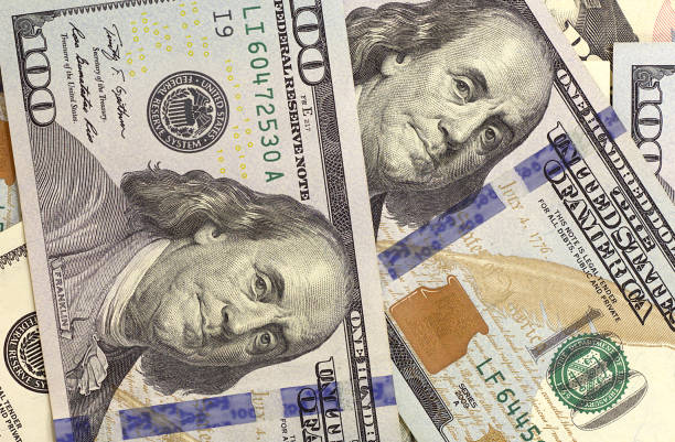 istock Abstract dollar bills of different denominations background. 652588164
