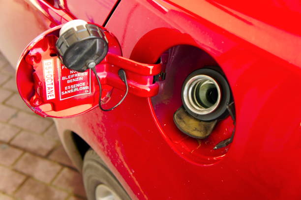 istock Refuelling fuel tank red car close-up 652592152