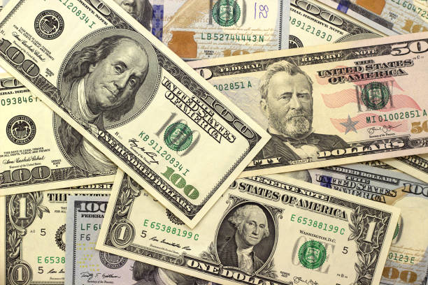 istock Abstract dollar bills of different denominations background. 652602158