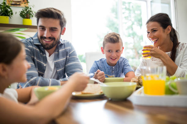 istock Happy family having breakfast 652605848