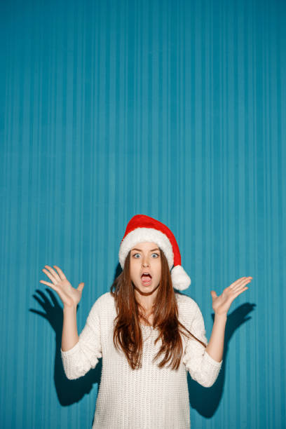 istock Surprised christmas girl wearing a santa hat 652620006