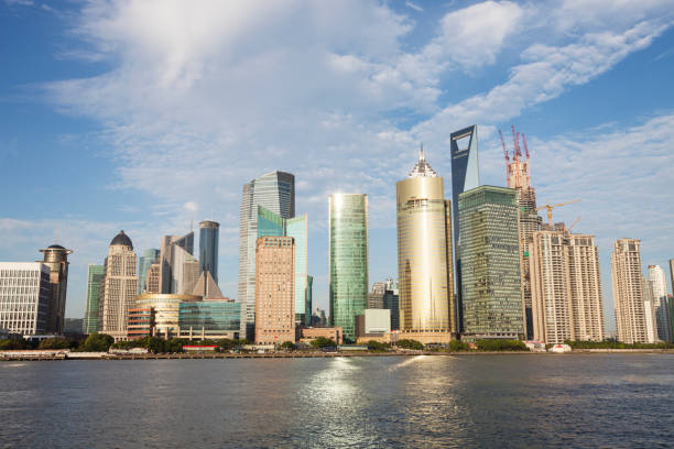 istock modern buildings near river in modern city 652620078