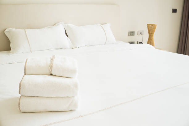 istock Clean folded towel are placed on the bed 652620940