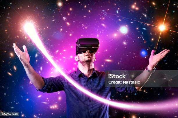 Man Using Virtual Reality Headset With Stock Photo - Download Image Now - Virtual Reality Simulator, Virtual Reality, Video Game