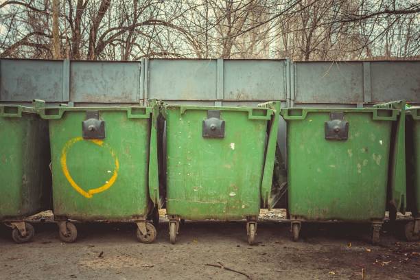 istock Old green dumpsters on the street. 652624572