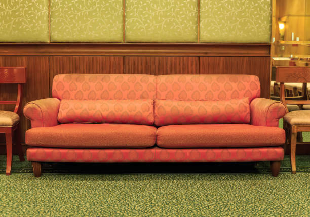 istock Orange sofa in the living room 652632928