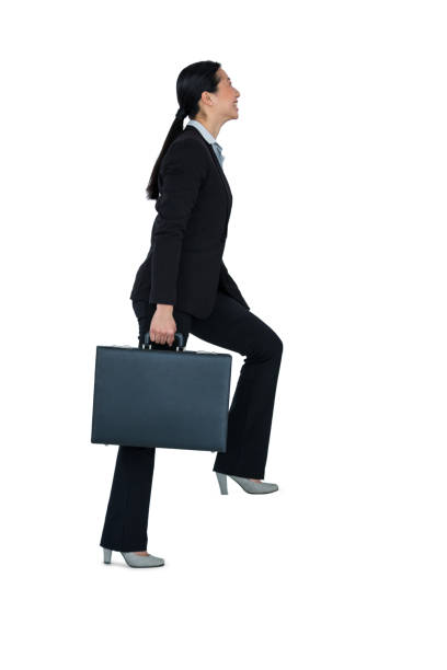 istock Businesswoman with briefcase walking on stairs 652647108