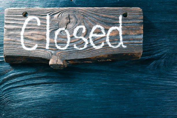 istock Wood signboard on black wood surface 652650606