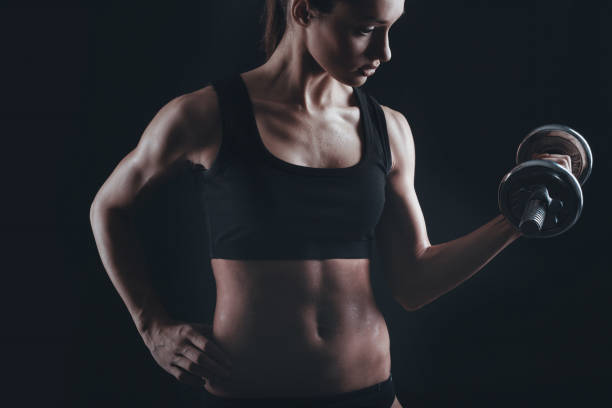 istock Strong fit woman exercising with dumbbells 652653184