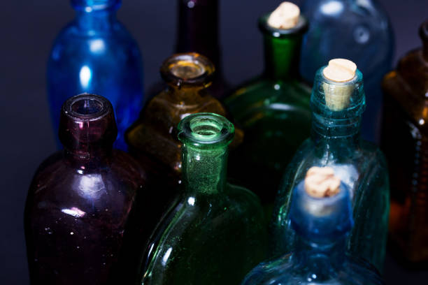 istock Old colourful bottles against a dark background 652660784