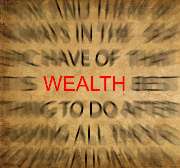 istock Blured text on vintage paper with focus on WEALTH 652664314